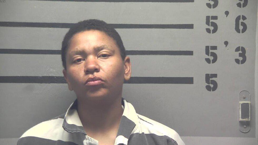 Woman arrested after running into traffic, police say