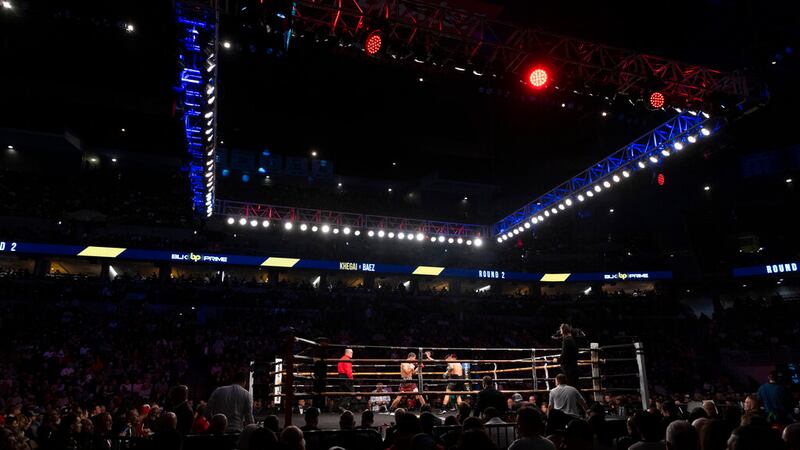 Eduardo Baez, left, fights Arnold Khegai during a featherweight boxing match on Saturday, Dec....