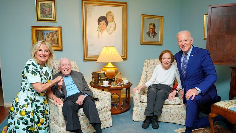 In this April 30, 2021, photo released by The White House, former President Jimmy Carter and...