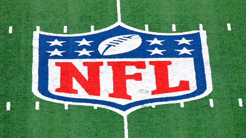 In this Nov. 2, 2020, file photo, the NFL logo is displayed at midfield during an NFL football...